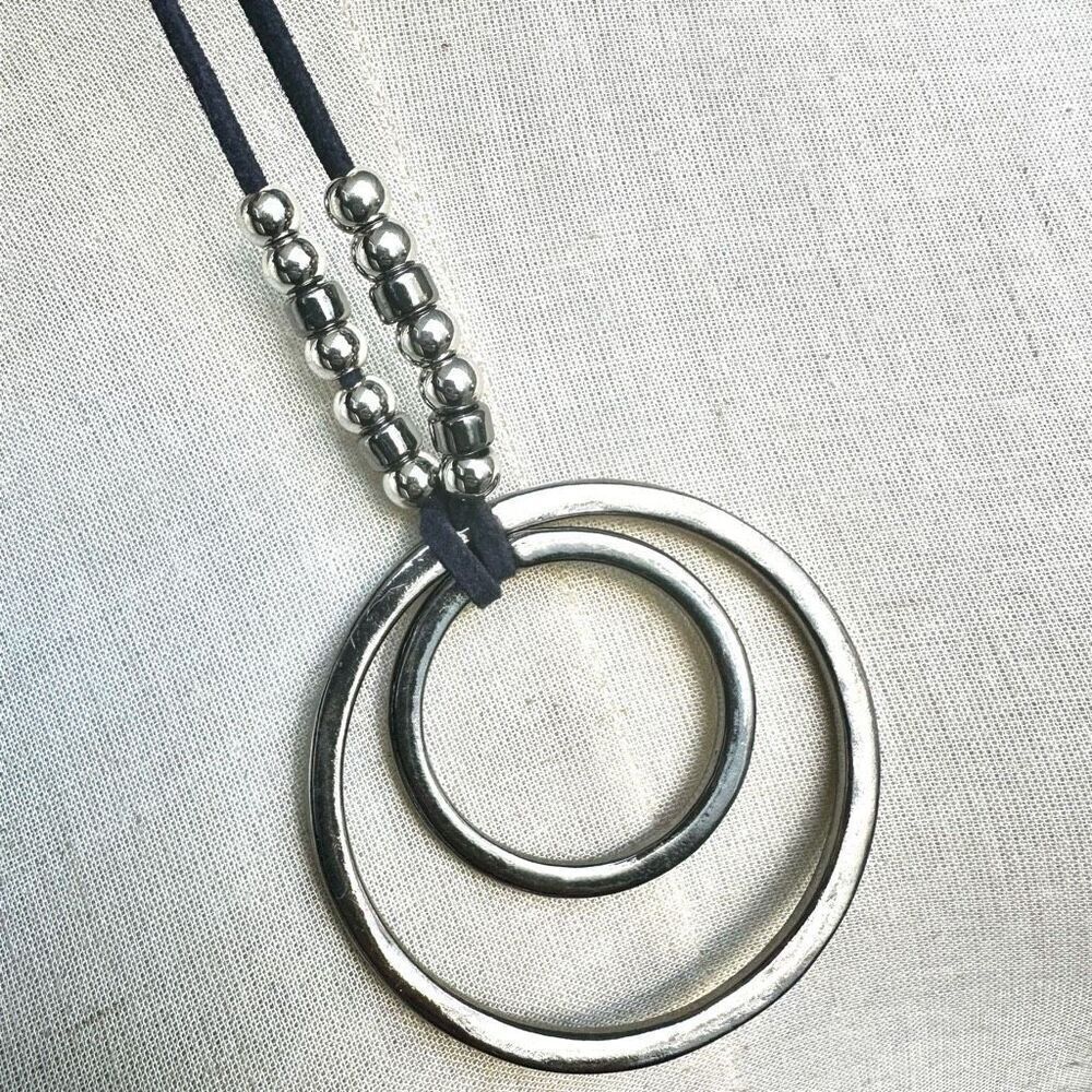 Long silver tone pendant necklace